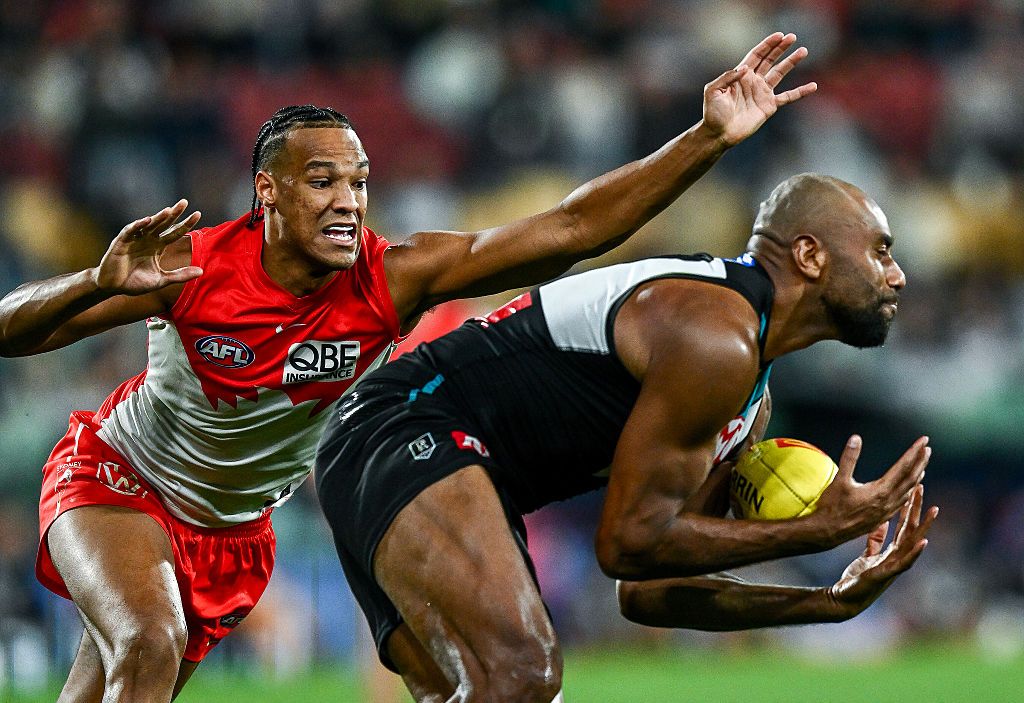 Port Adelaide and Sydney players contest the ball at Adelaide Oval